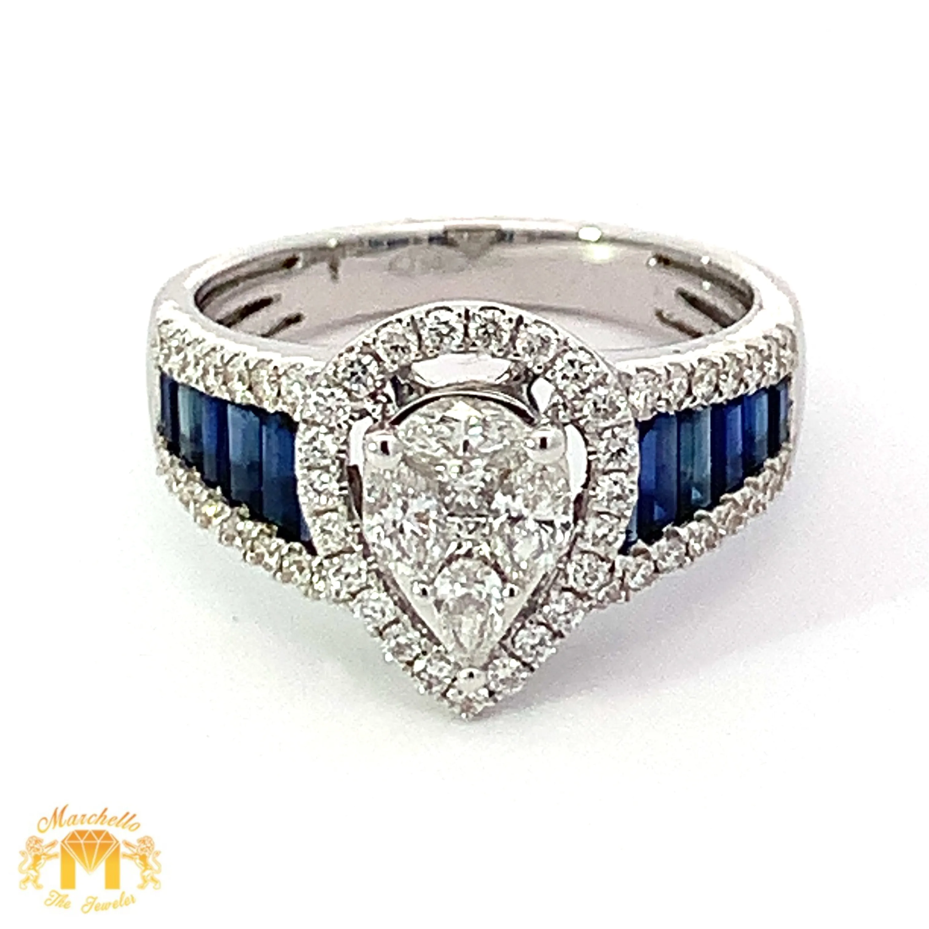 VVS/vs EF color high clarity diamonds set in a 18k Gold Pear Shaped Ring with Blue Sapphire