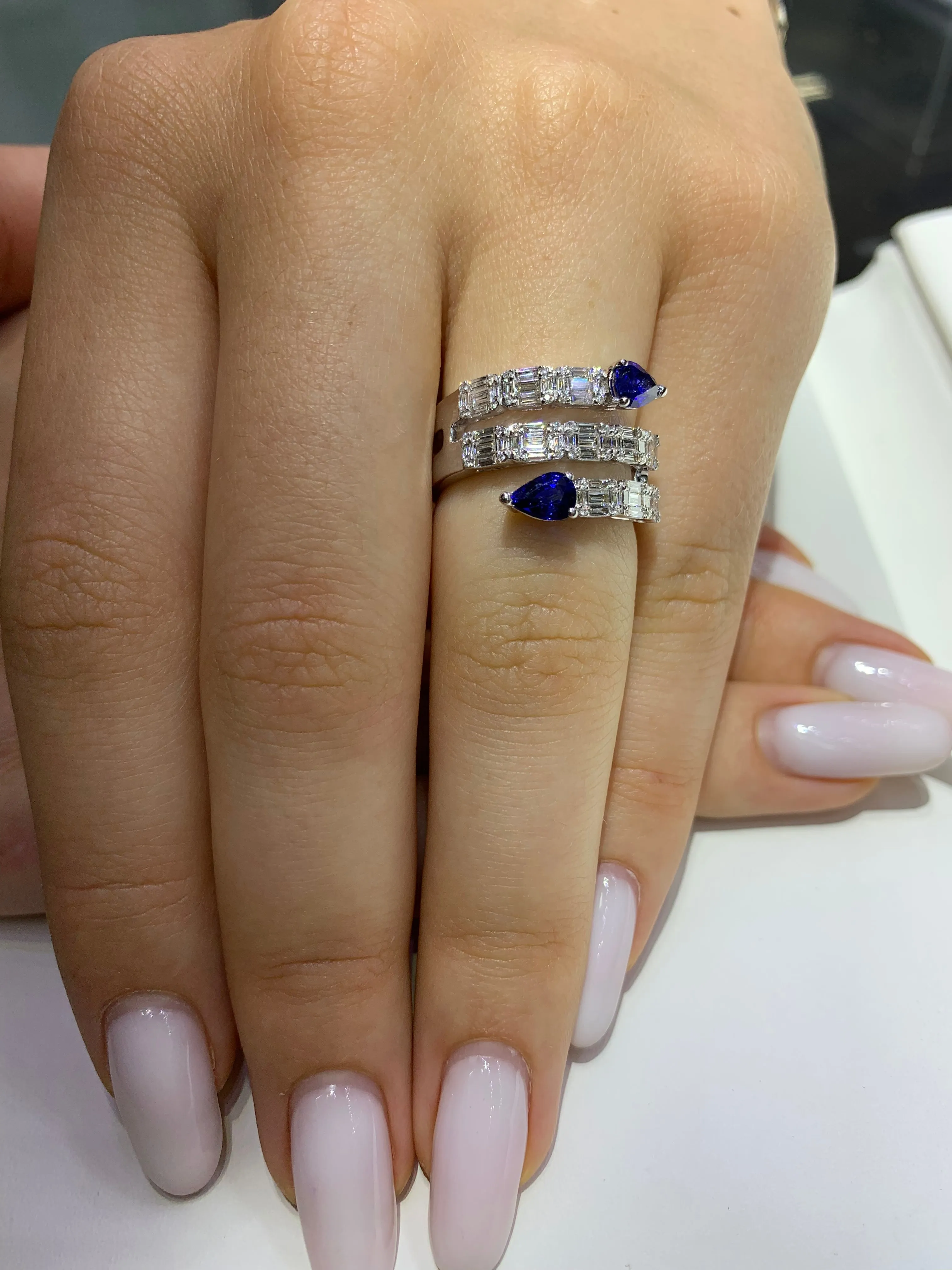 VVS/vs EF color high clarity diamonds set in a 18k Gold Stack Blue Sapphire Ring with Baguette Diamonds